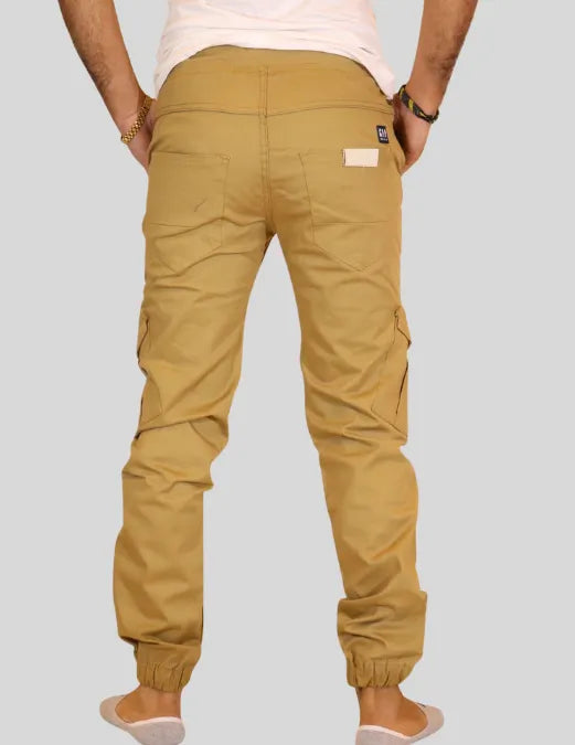 Beige cargo pants worn by a person on a plain background