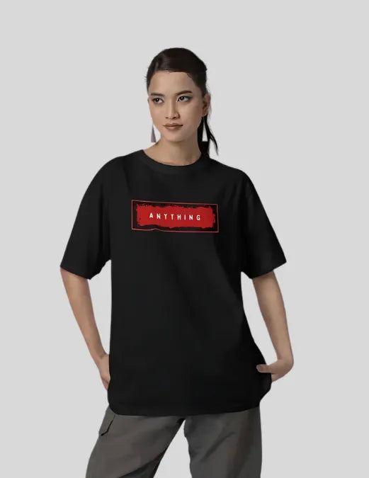 Person wearing a black t-shirt with a red logo and text on a plain background