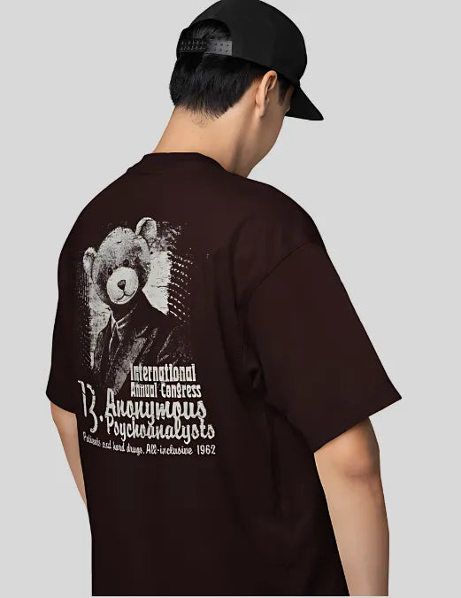 Person wearing a black t-shirt with a bear graphic and text on the back, standing against a plain background.
