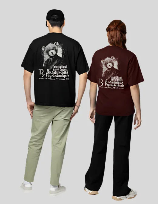 Two people wearing t-shirts with a bear graphic and text on a plain background